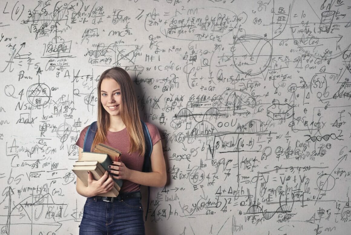 woman holding books showing Social Networks for Math Majors