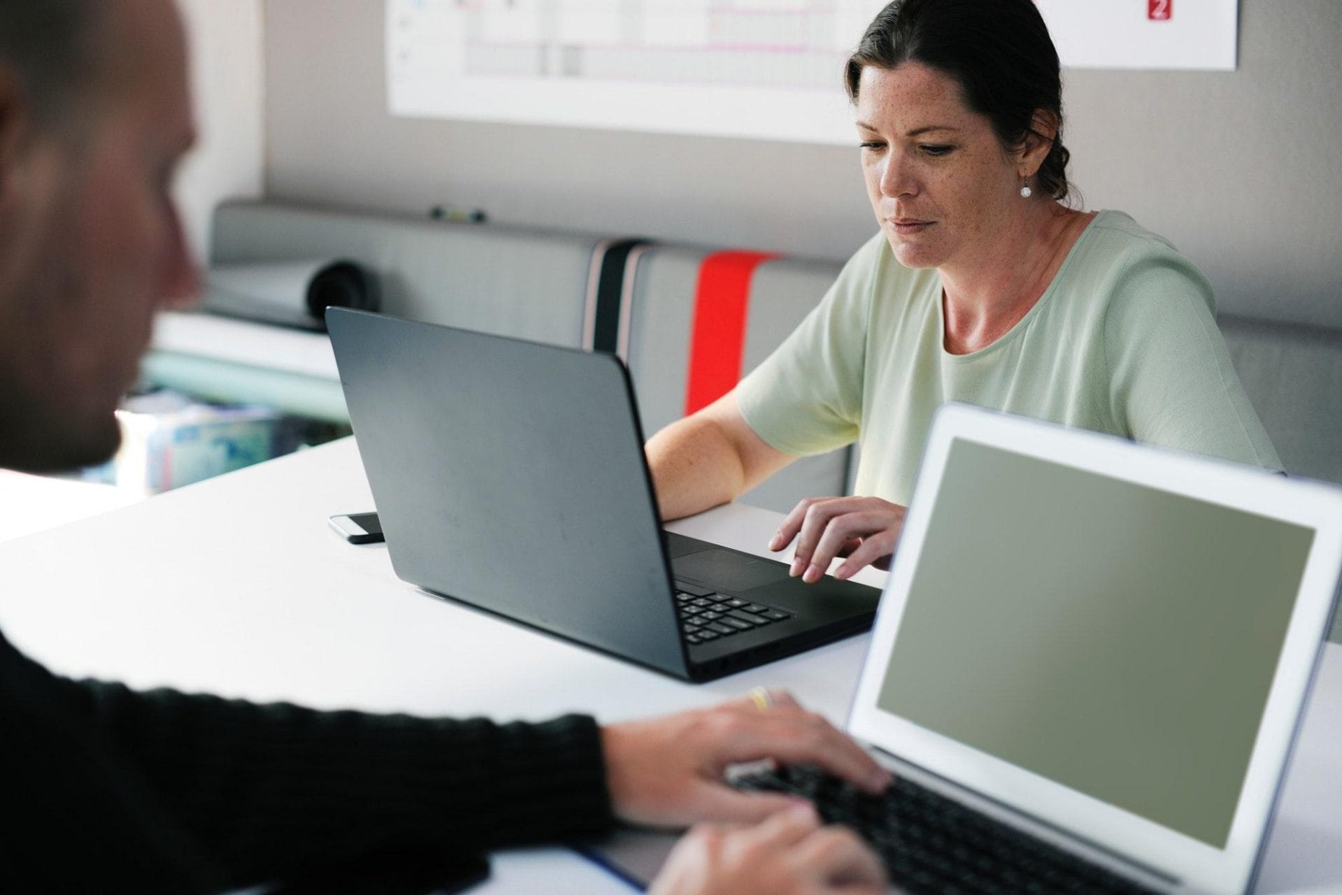 woman with laptop understanding cobit and coso