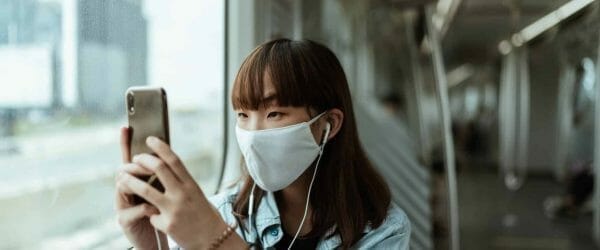 woman wearing a face mask on the subway