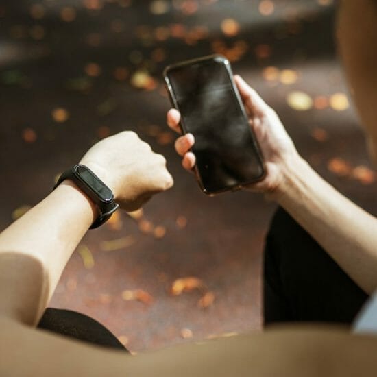 faceless woman using devices for health monitoring