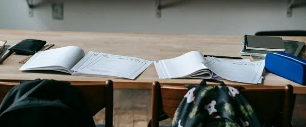 school bench with copybooks and stationery