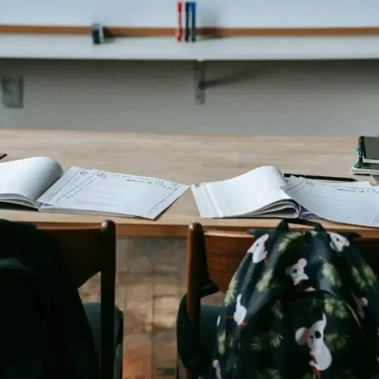 school bench with copybooks and stationery