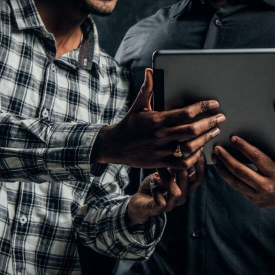 Tablet computer which is kept by three Indian students