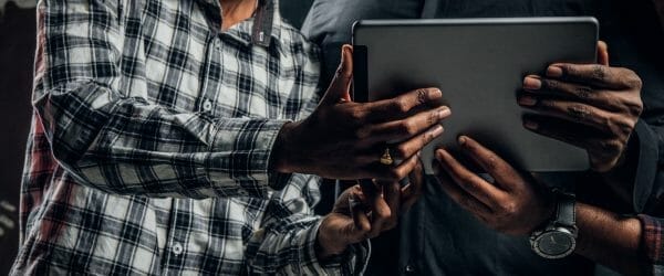 Tablet computer which is kept by three Indian students