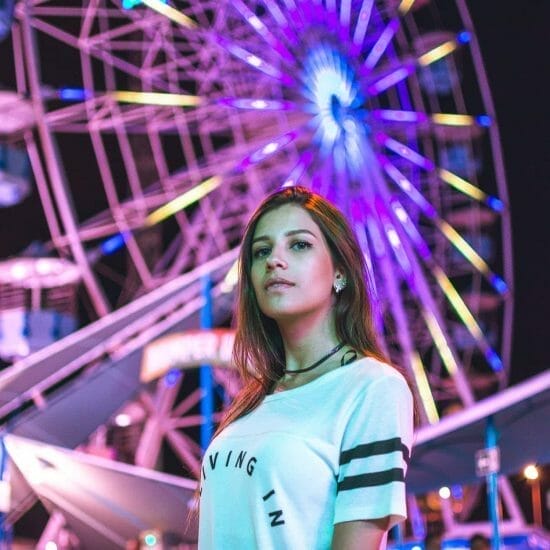 low angle photography of female on carnival