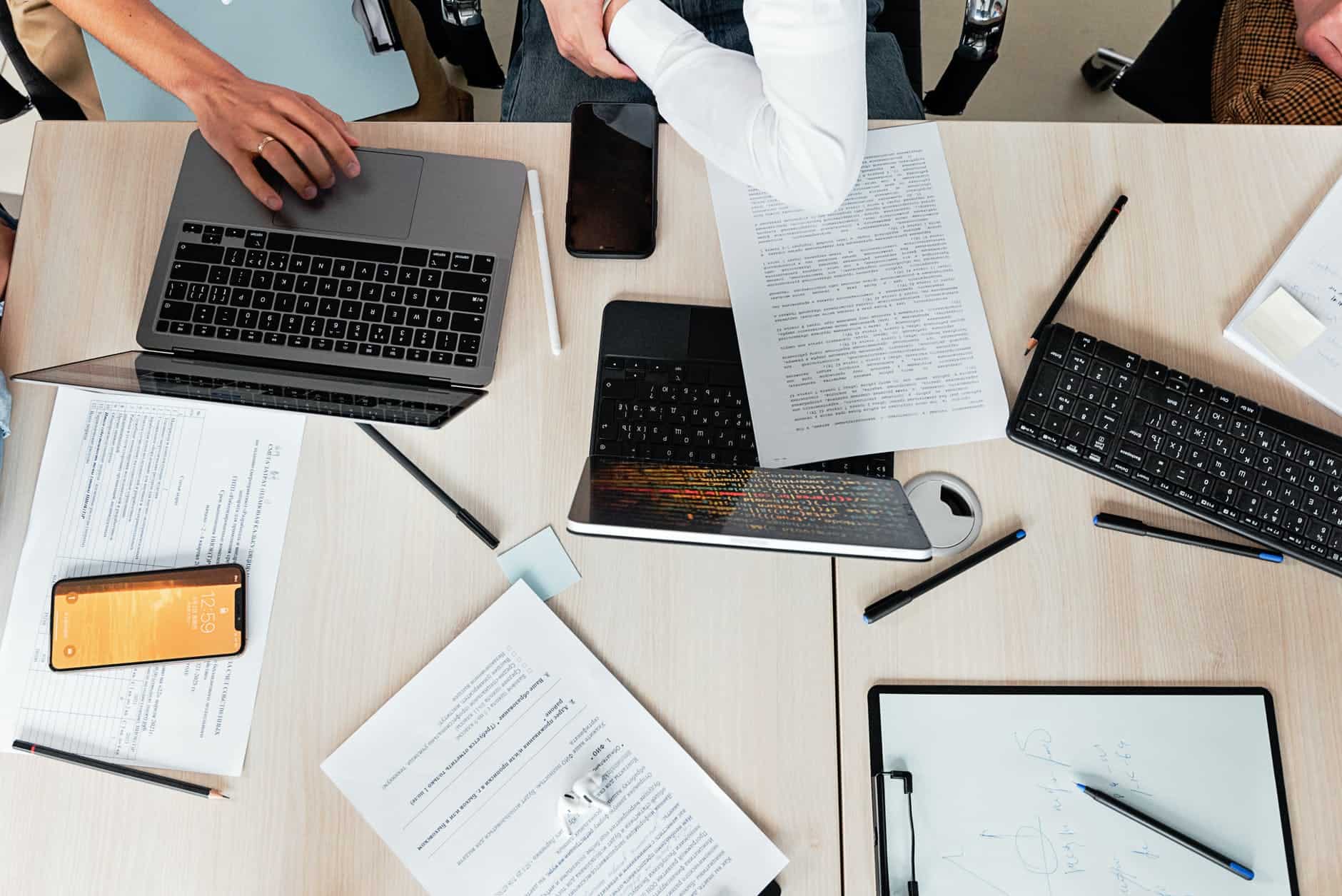 person using macbook pro on table, How to find remote web developer jobs