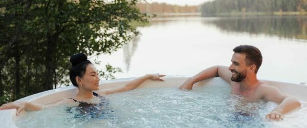 couple looking at each other while relaxing in a jacuzzi