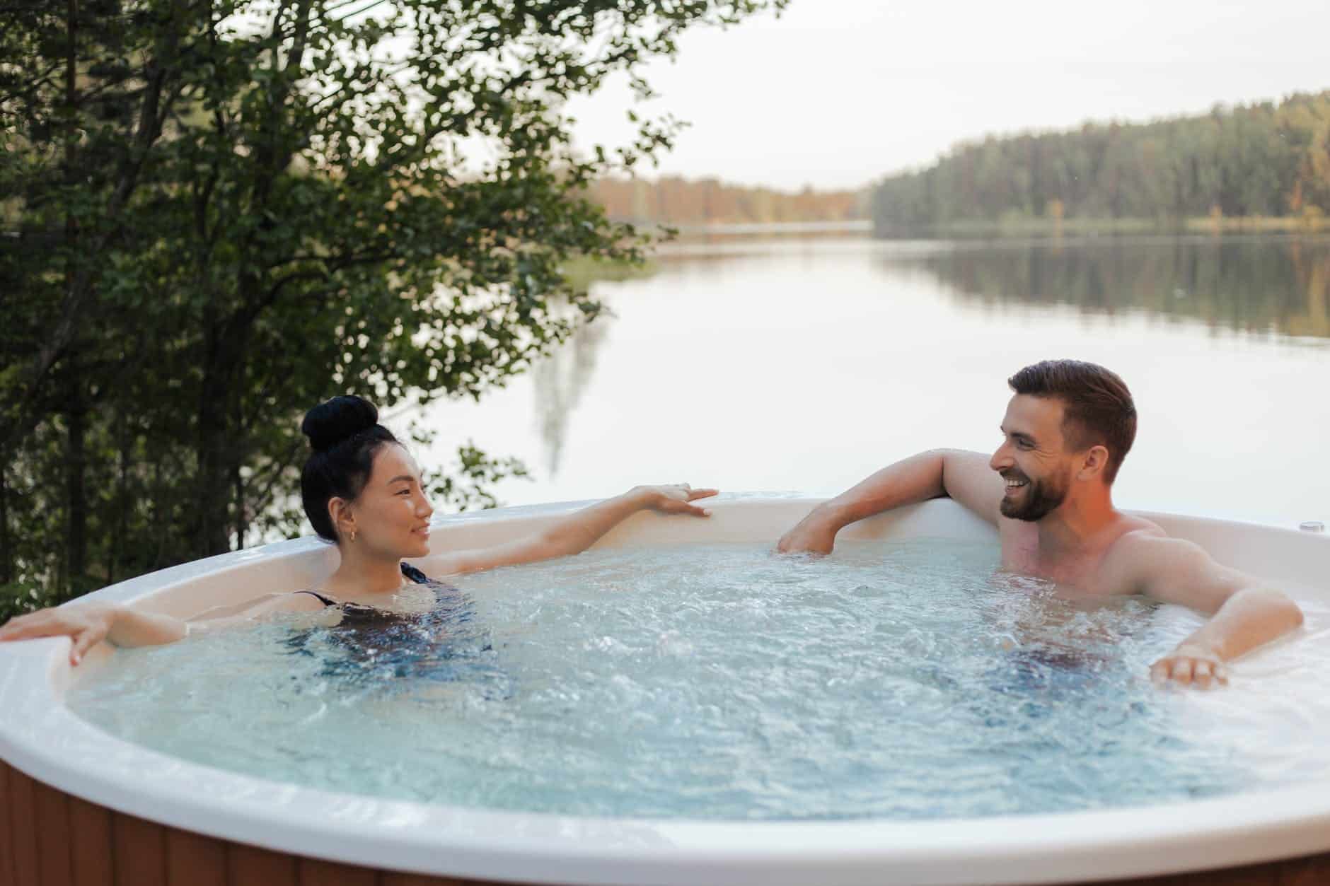 couple looking at each other while relaxing in a jacuzzi