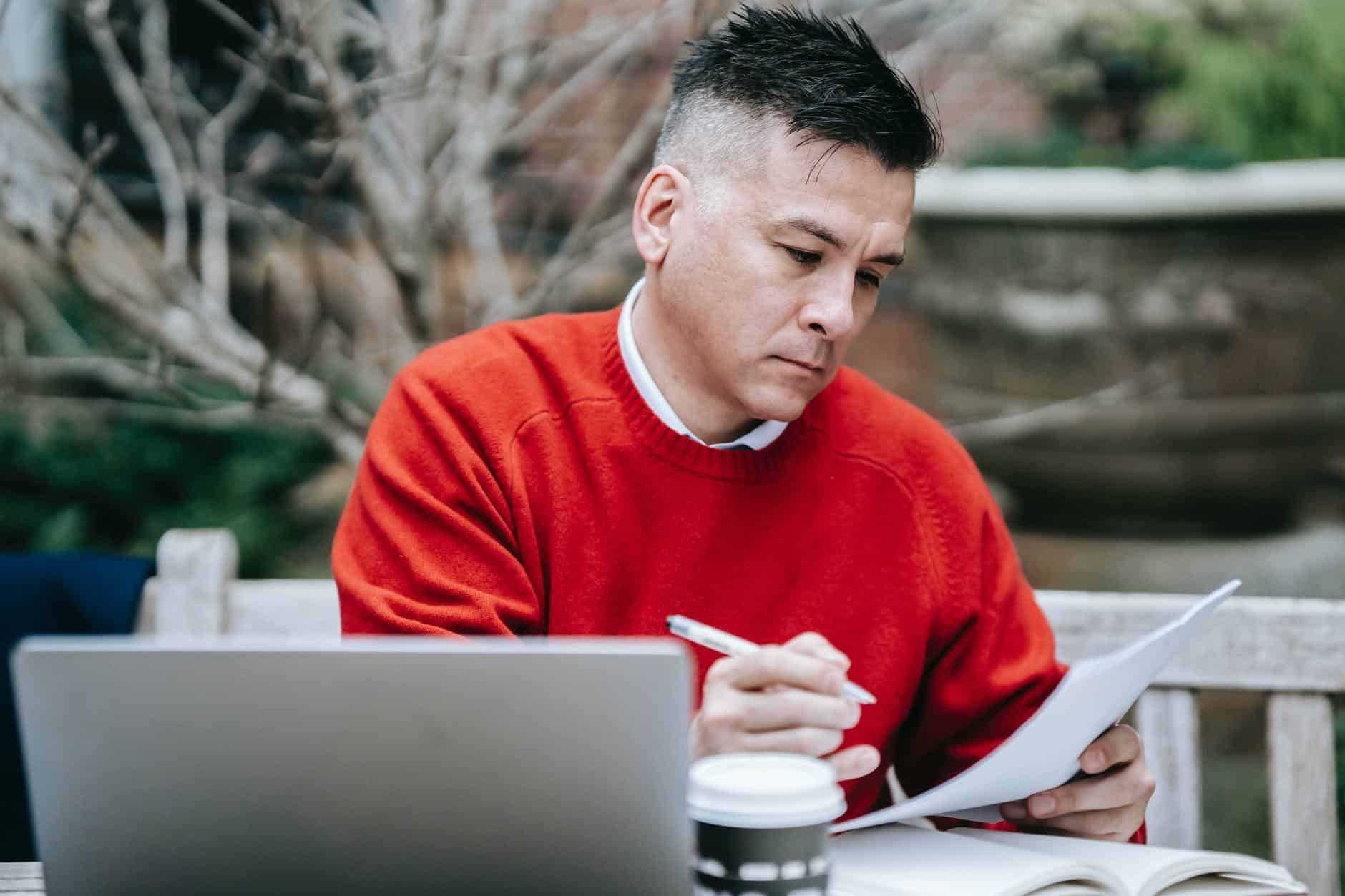 photo of man reviewing documents