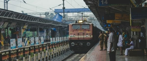 People watching as a train approaches in India