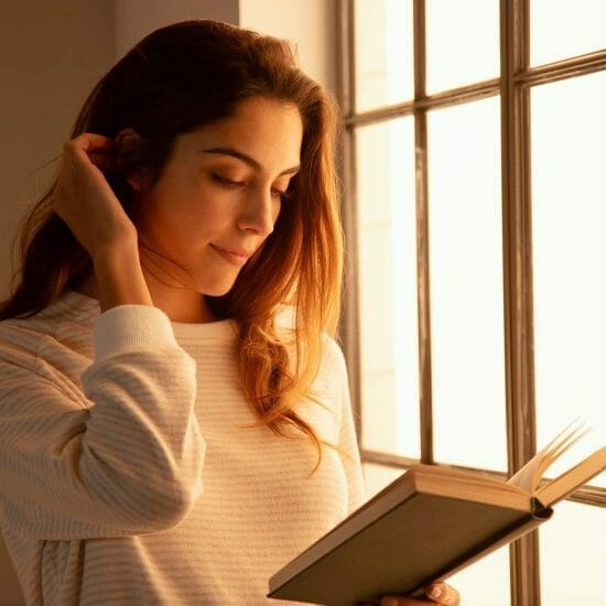 young woman reading a book