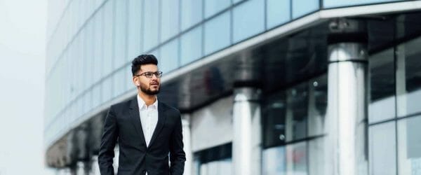 modern indian man goes business meeting him modern building