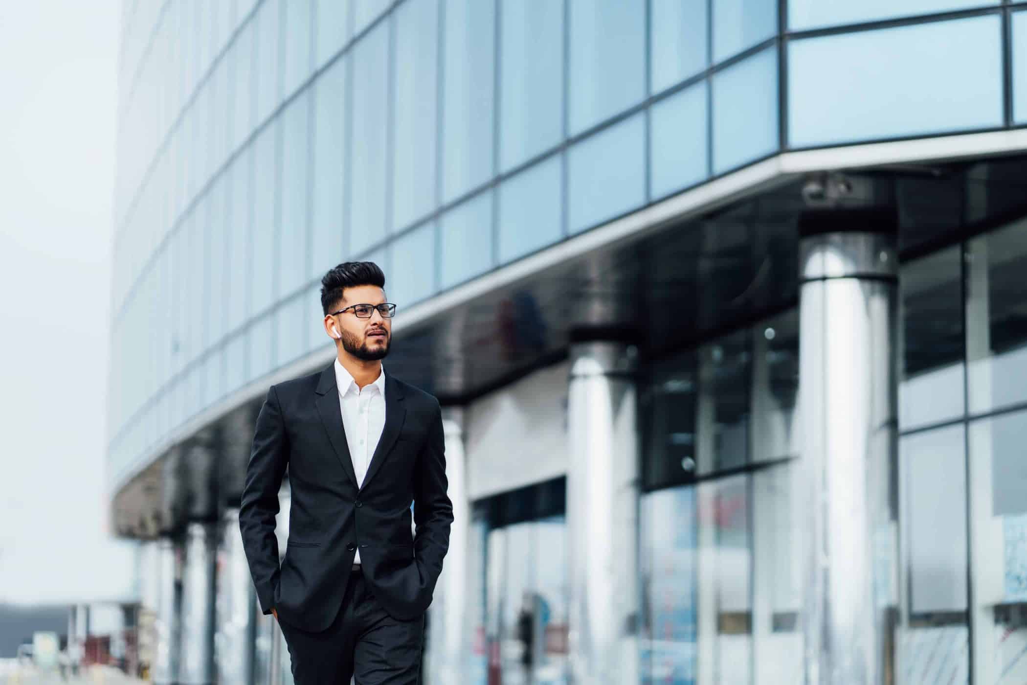 modern indian man goes business meeting him modern building