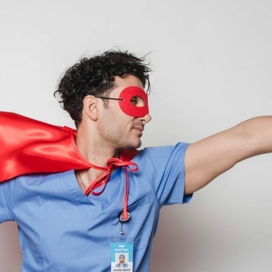 brave doctor in flying superhero cape with fist stretched