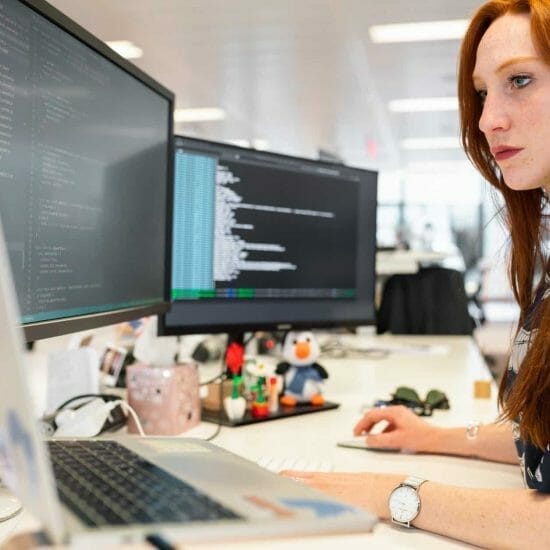 woman coding on computer