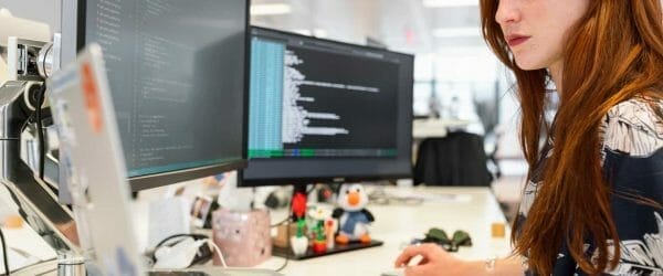 woman coding on computer