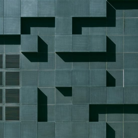 gray concrete building exterior with geometric design