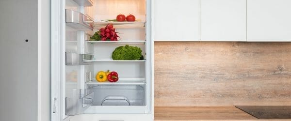 fridge with different vegetable in modern kitchen