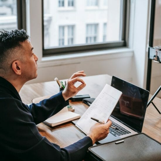 photo of man having an online education session