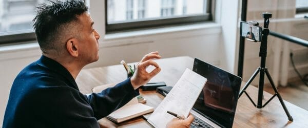 photo of man having an online education session