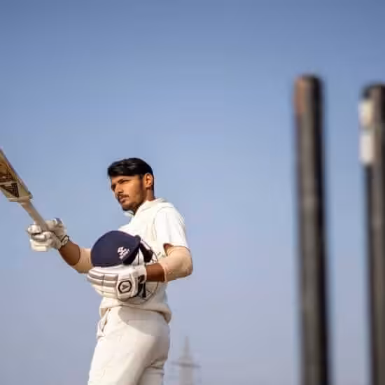 a man holding a wooden paddle