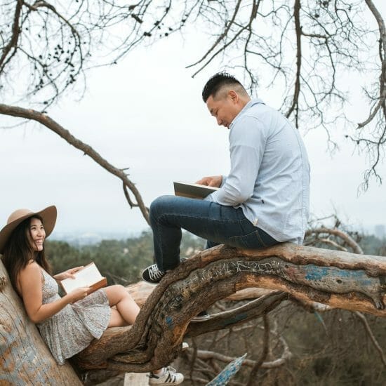 couple reading books outside