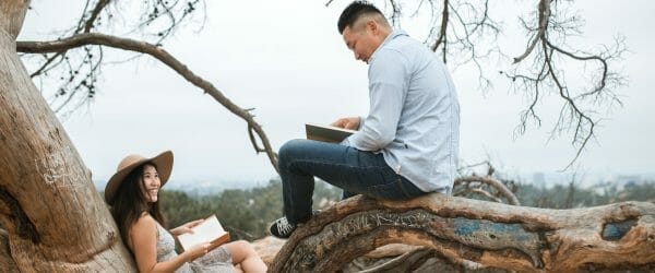 couple reading books outside