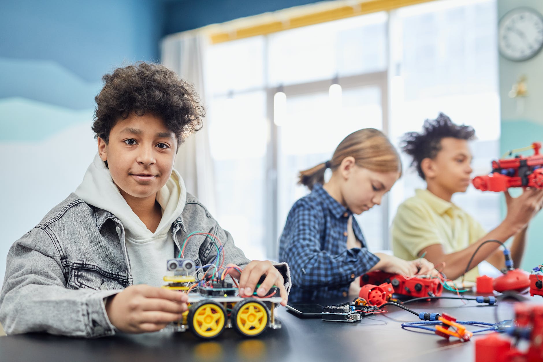 Kids making Robotic STEM Toys