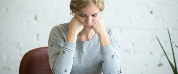 portrait tired student woman desk