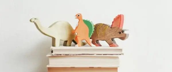 three wooden dinosaur