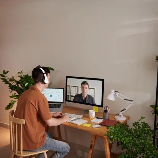 man attending online meeting