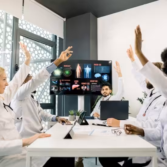 a group of doctors in a meeting showing the The Role of Conferencing Technology in Modern Healthcare