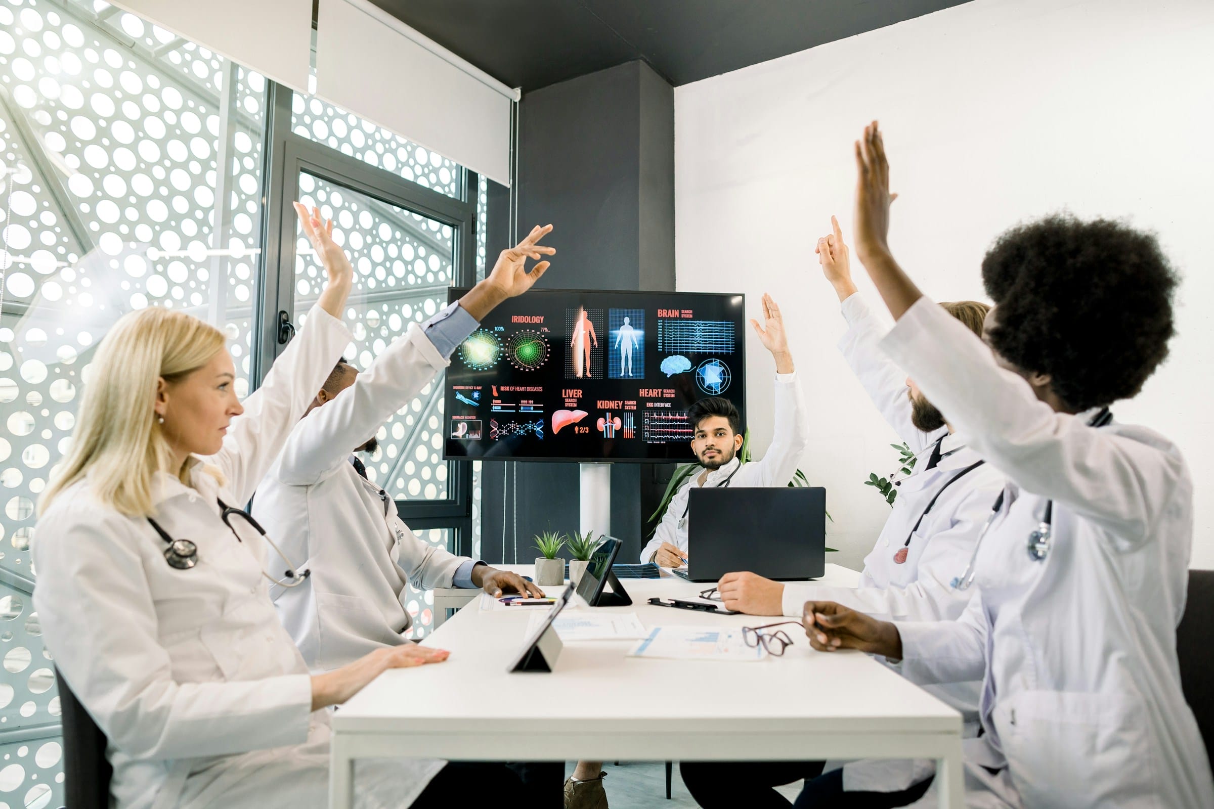 a group of doctors in a meeting showing the The Role of Conferencing Technology in Modern Healthcare