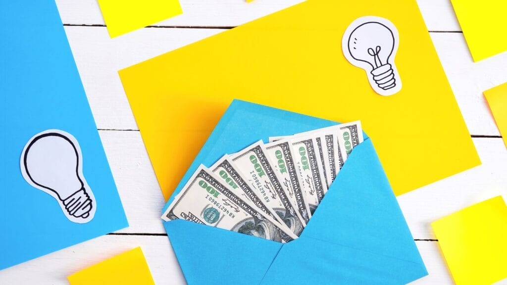 blue envelope with money with yellow blue papers icons lamp
