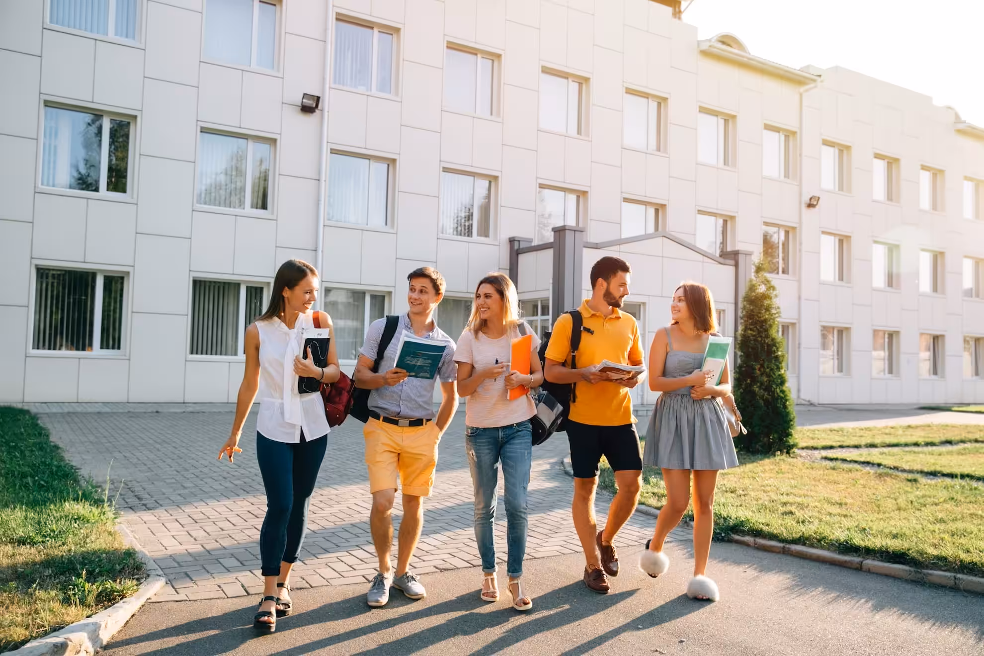 free time students bachelor s campus life rhythm five friendly students are walking