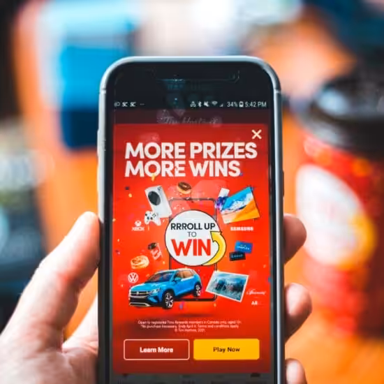 red and black smartphone with money winning apps