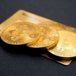 Bitcoin coins with credit card background