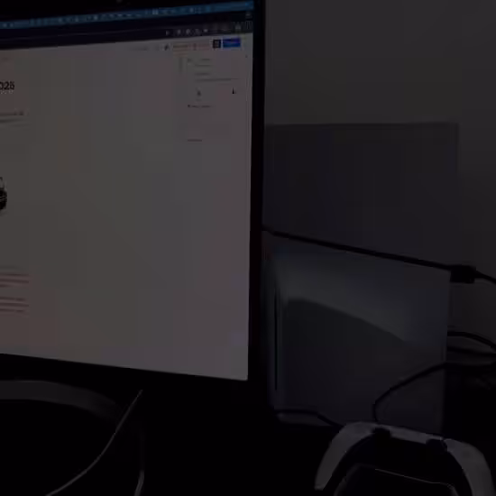 PlayStation console next to computer monitor